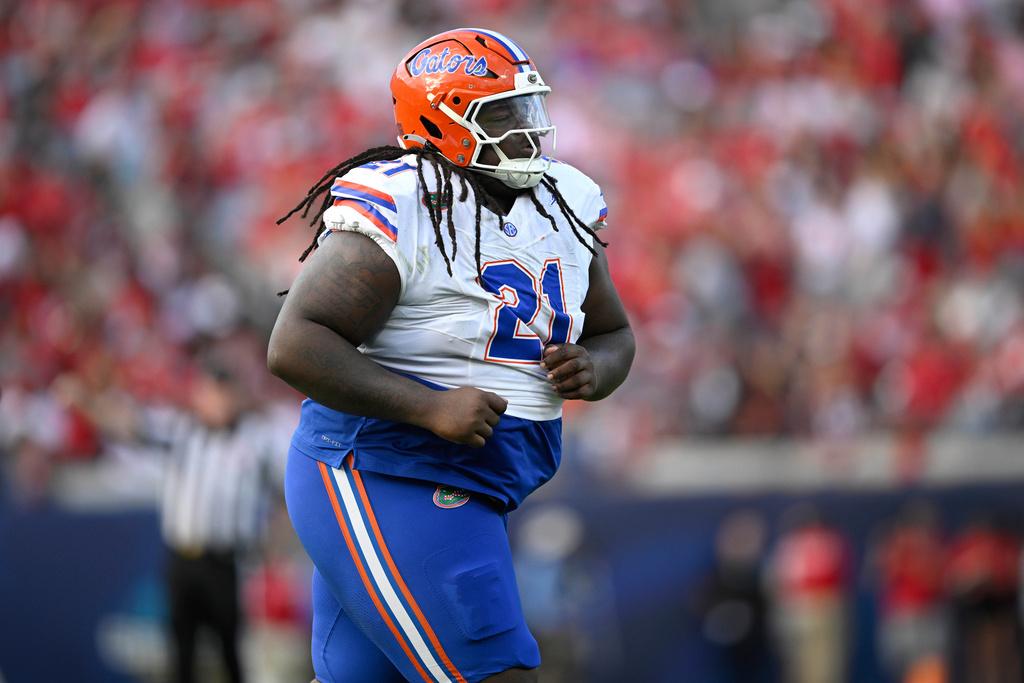 Florida defensive lineman Desmond Watson (21) runs off the field against Georgia during the first half of an NCAA college football game, Nov. 2, 2024, in Jacksonville, Fla.
