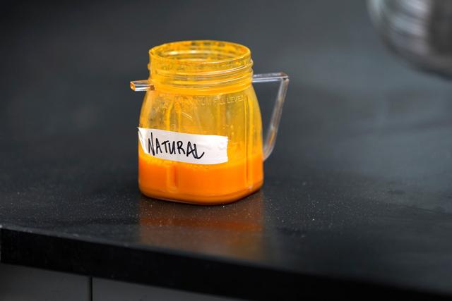 Natural food coloring is held in a jar in a lab at Sensient Technologies Corp., a color additive manufacturing company, in St. Louis.