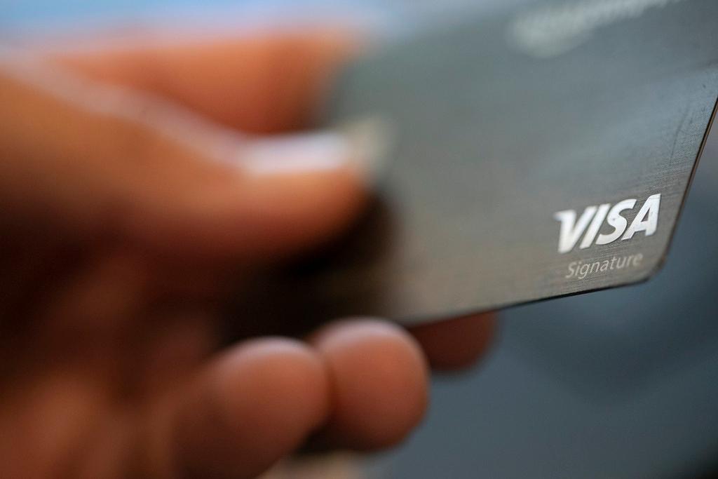 Visa logo is displayed on a credit card 