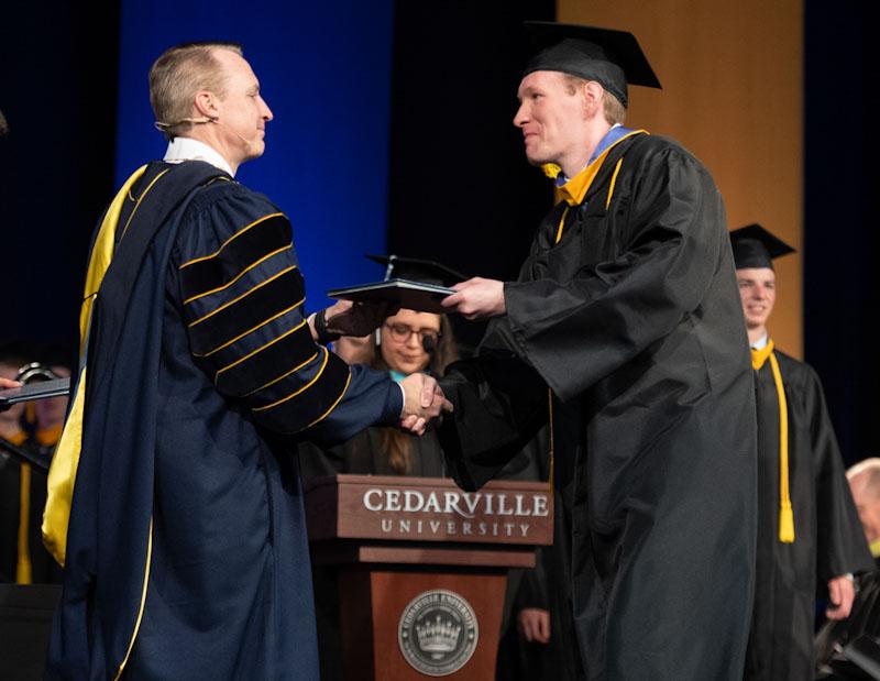 David Reid, graduating with dual degrees in computer science and cyber operations, will begin his career with the U.S. Department of Defense