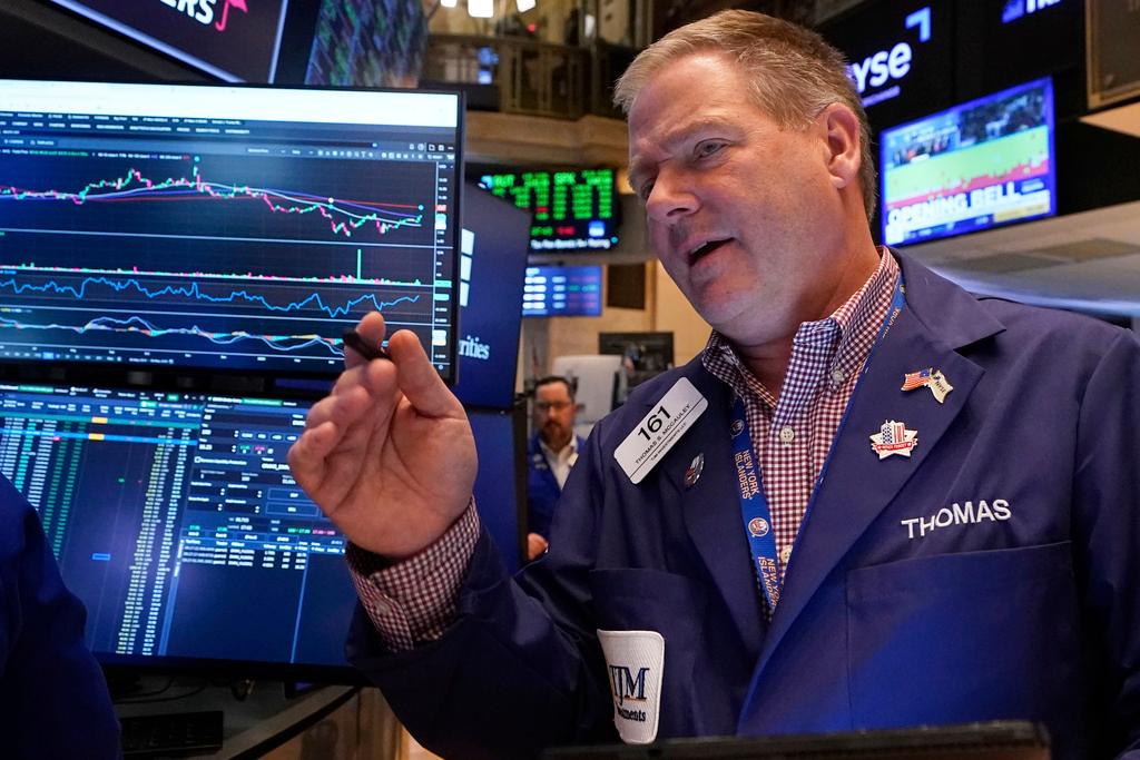 Trader Thomas McCauley works on the floor of the New York Stock Exchange