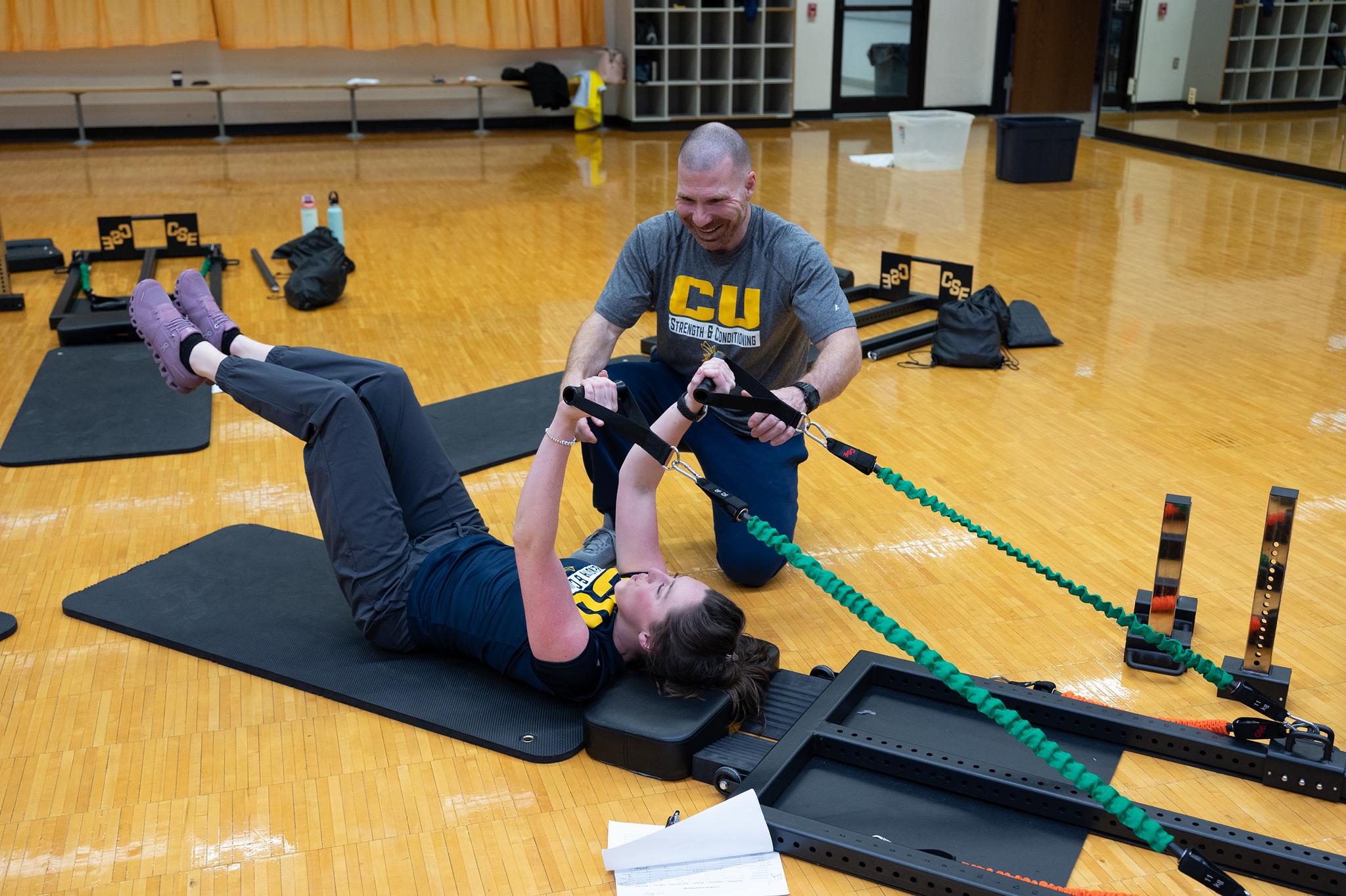 USING THE TRAINER — Peterson showed each class member how to use the new device, including Sarah Gump, director of strategic communications for Cedarville