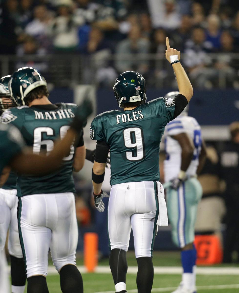 Football Game- Foles's back raising hand 
