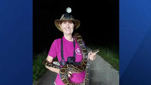 Woman with snakes and a light on her head