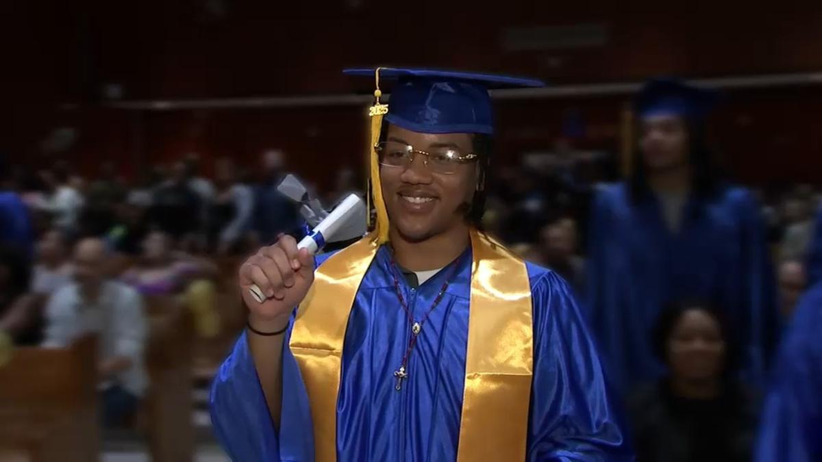 Young person dressed in a graduation cap and gown.