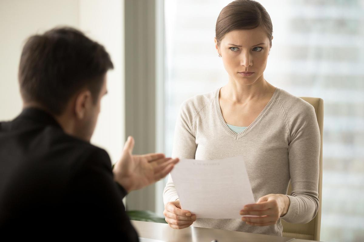 woman looks at man with doubt