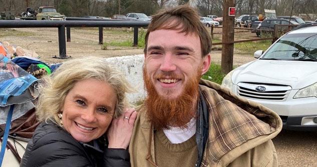 Teresa smiling next to a man with a beard