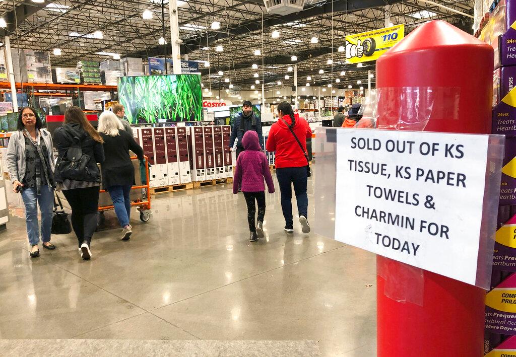 Frustrated shoppers visit a Costco Wholesale in Tigard, Ore.