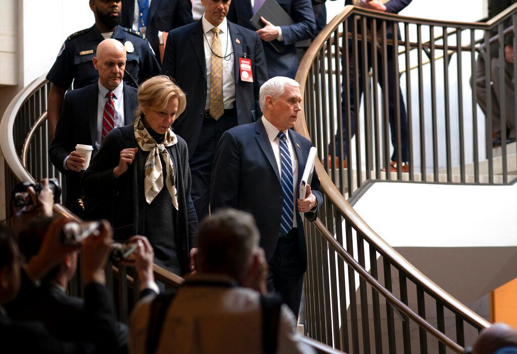 Vice President Mike Pence, joined at left by Dr. Deborah Birx, the coronavirus response coordinator, arrives at the Capitol 