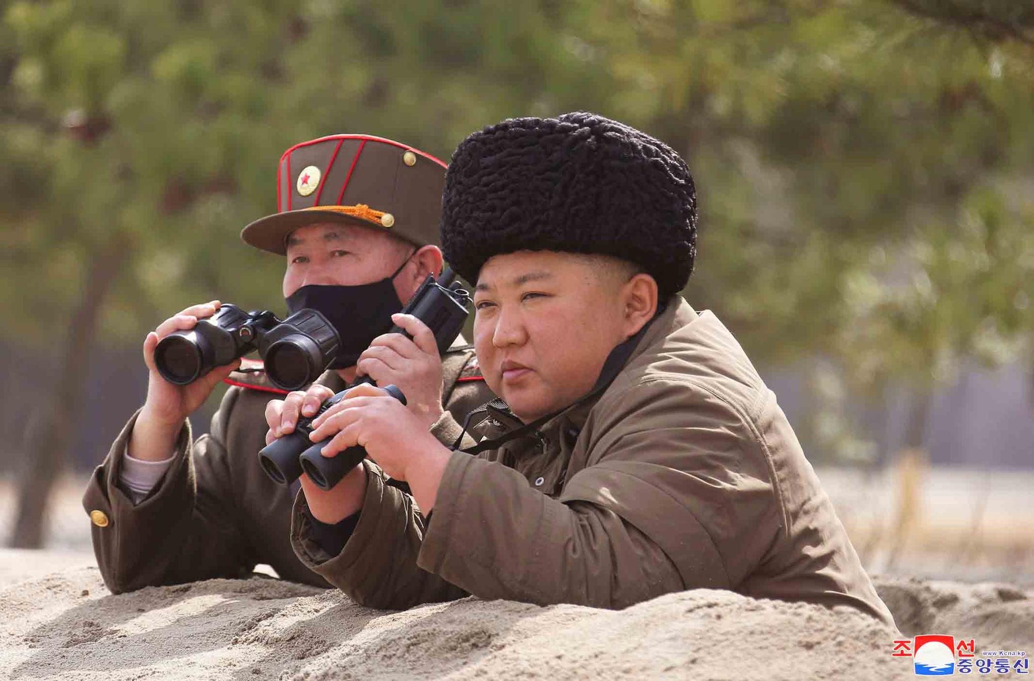n this photo provided by the North Korean government, North Korean leader Kim Jong Un inspects a military drill at an undisclosed location in North Korea on Monday, March 9, 2020.