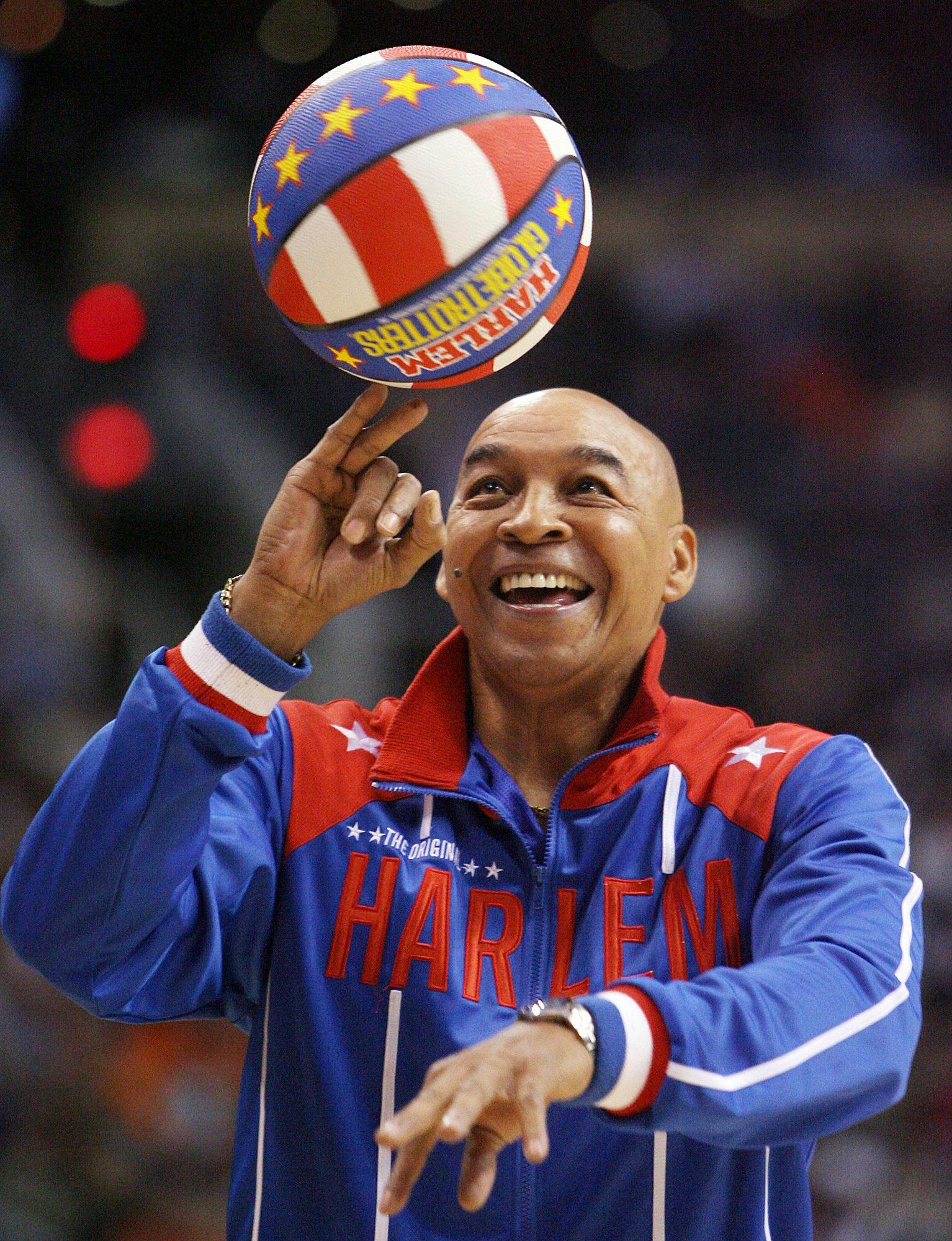 Harlem Globetrotters' Fred Curly Neal handling basketball