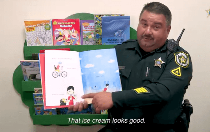 Master Deputy Frank DelGuercio reads "We're All Wonders"