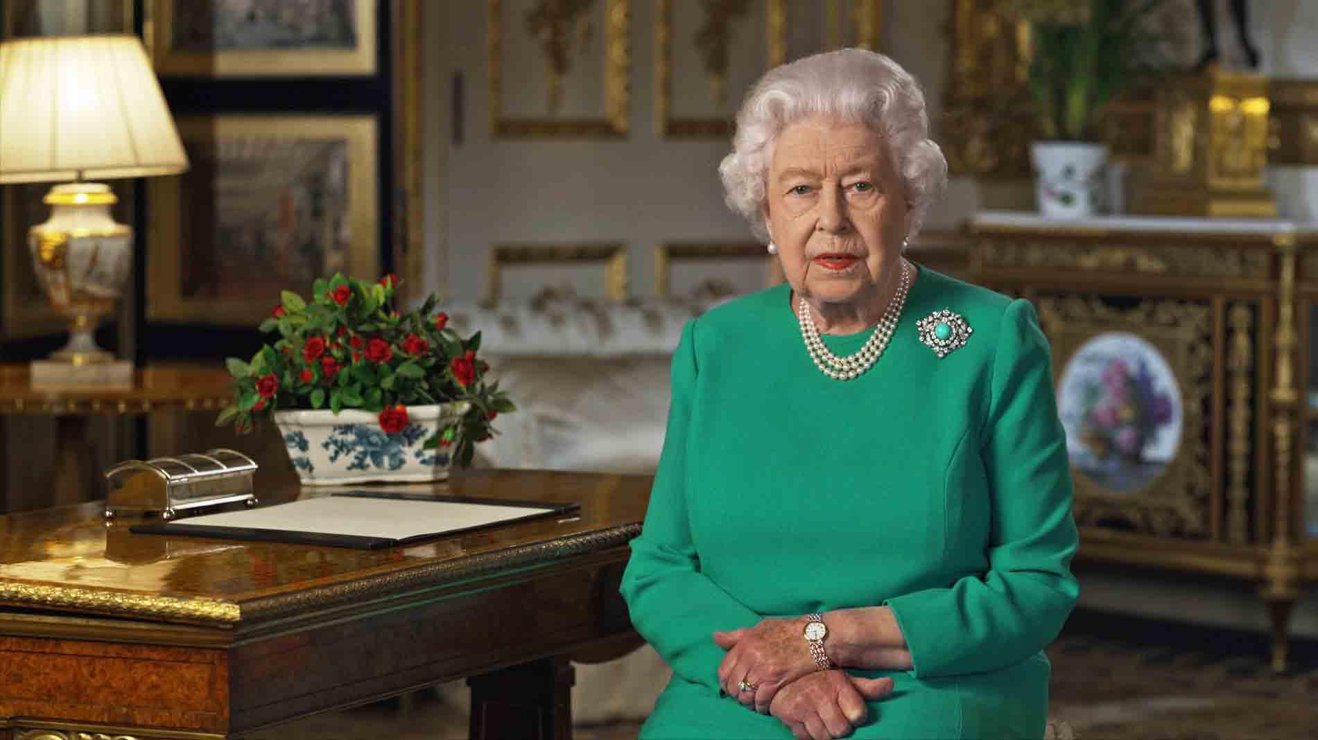 In this image taken from video and made available by Buckingham Palace, Britain's Queen Elizabeth II addresses the nation and the Commonwealth from Windsor Castle, Windsor, England