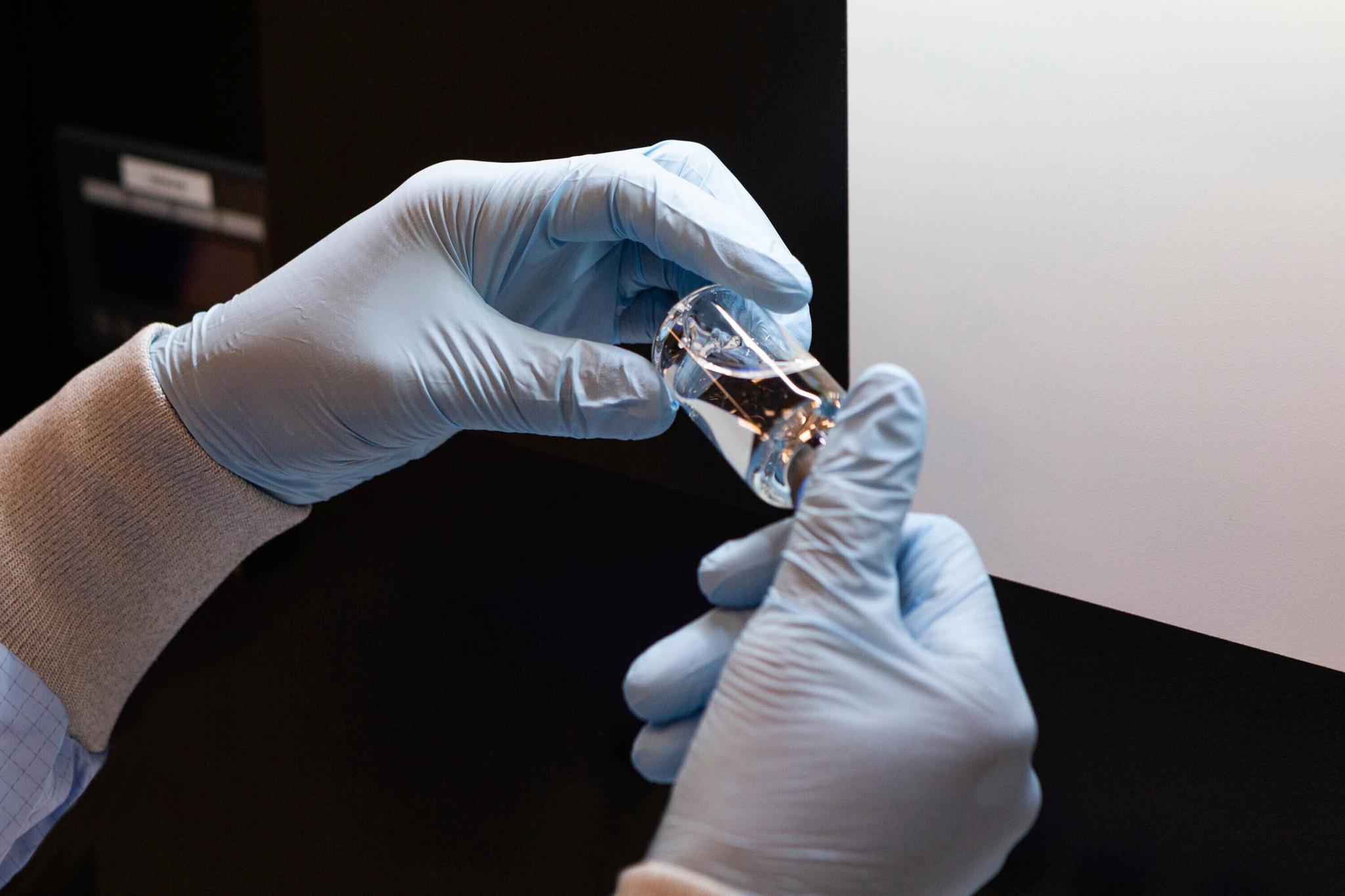 Vial of the experimental drug remdesivir visually inspected