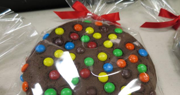 plastic-wrapped chocolate cookies with M and M's and red bow