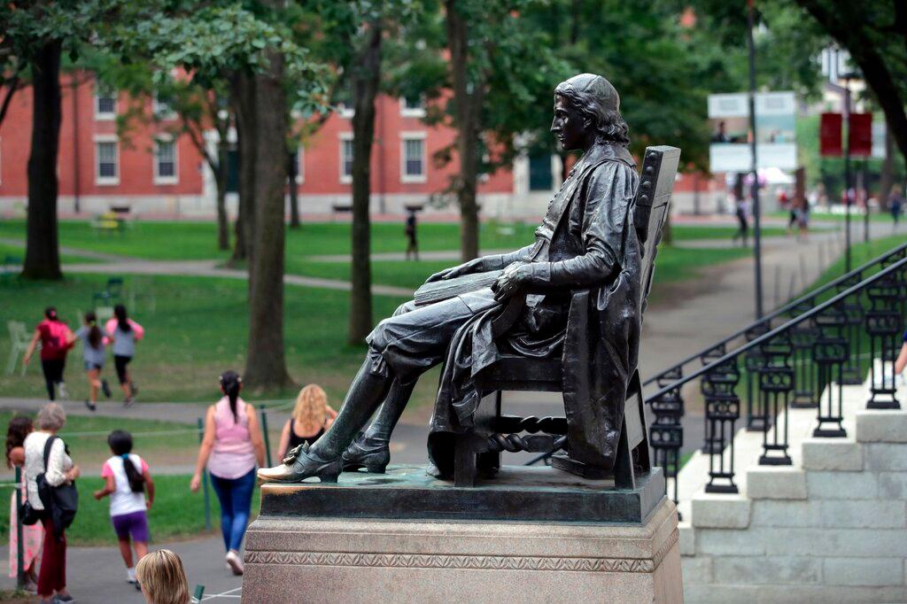 Statue of John Harvard in Harvard Yard at Harvard University in Cambridge, Mass.