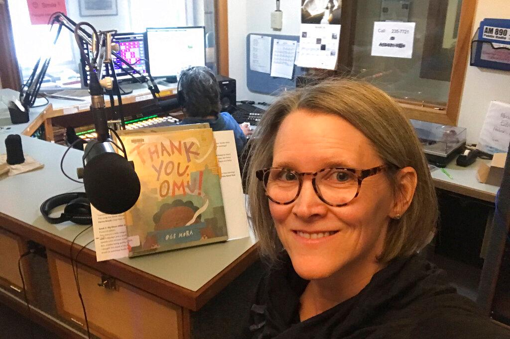 Librarian Claudia Haines, she poses for the selfie while preparing to read stories on the air at local radio station KBBI in Homer, Alaska. 