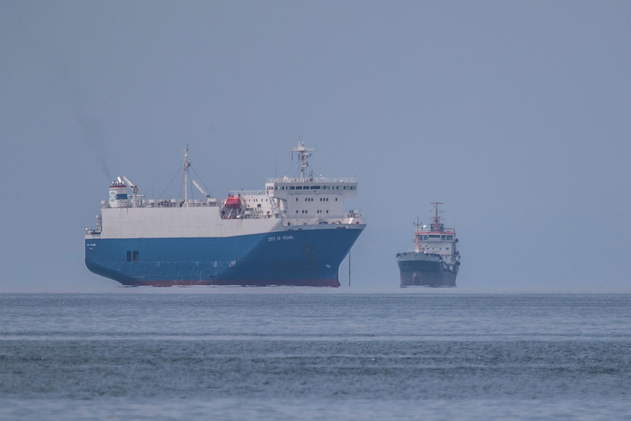 Anchored ships are seen miles away from the port
