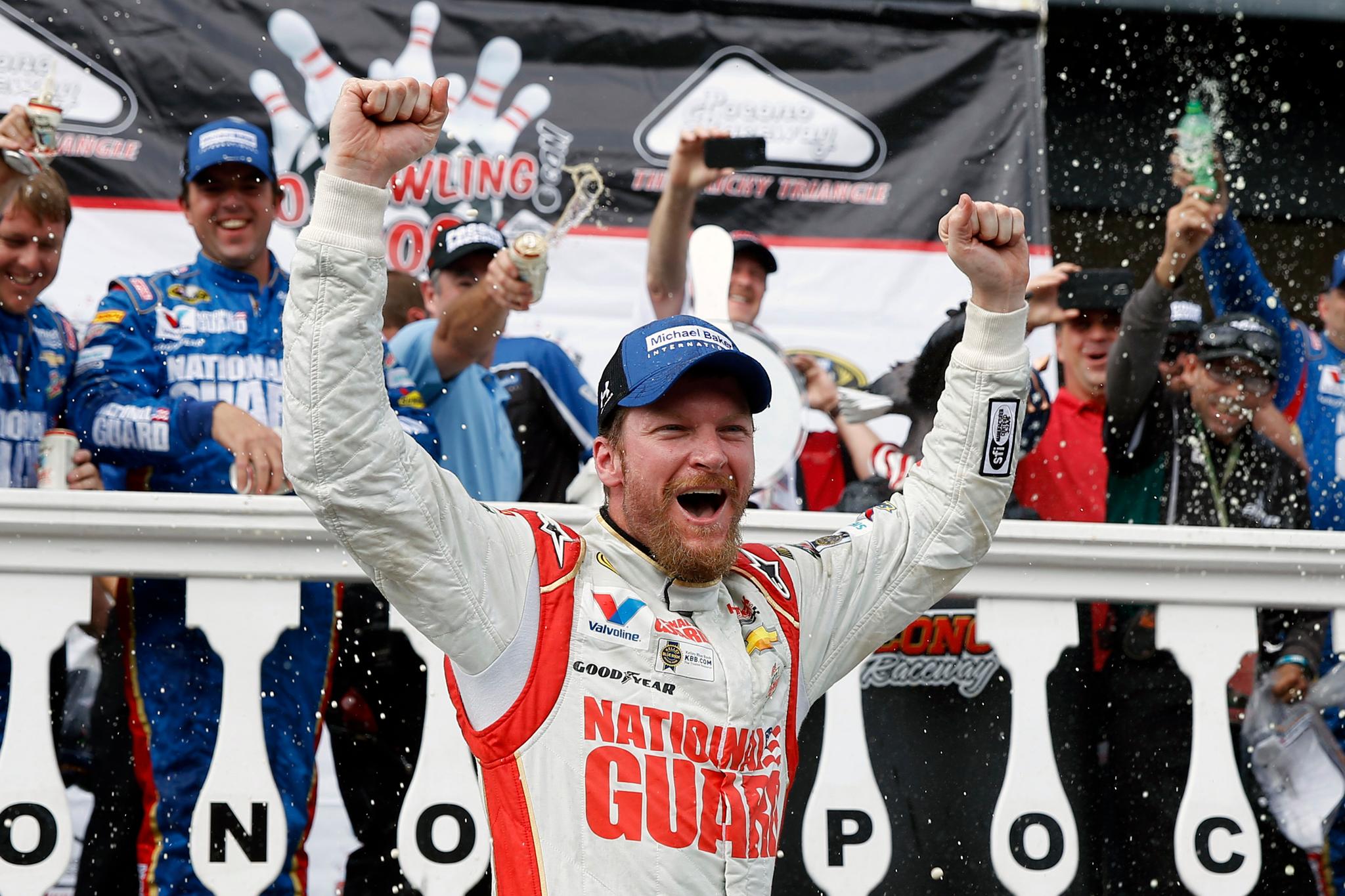 Dale Earnhardt Jr. celebrates in Victory Lane after winning a NASCAR Sprint Cup Series auto race at Pocono Raceway in Long Pond, Pa.