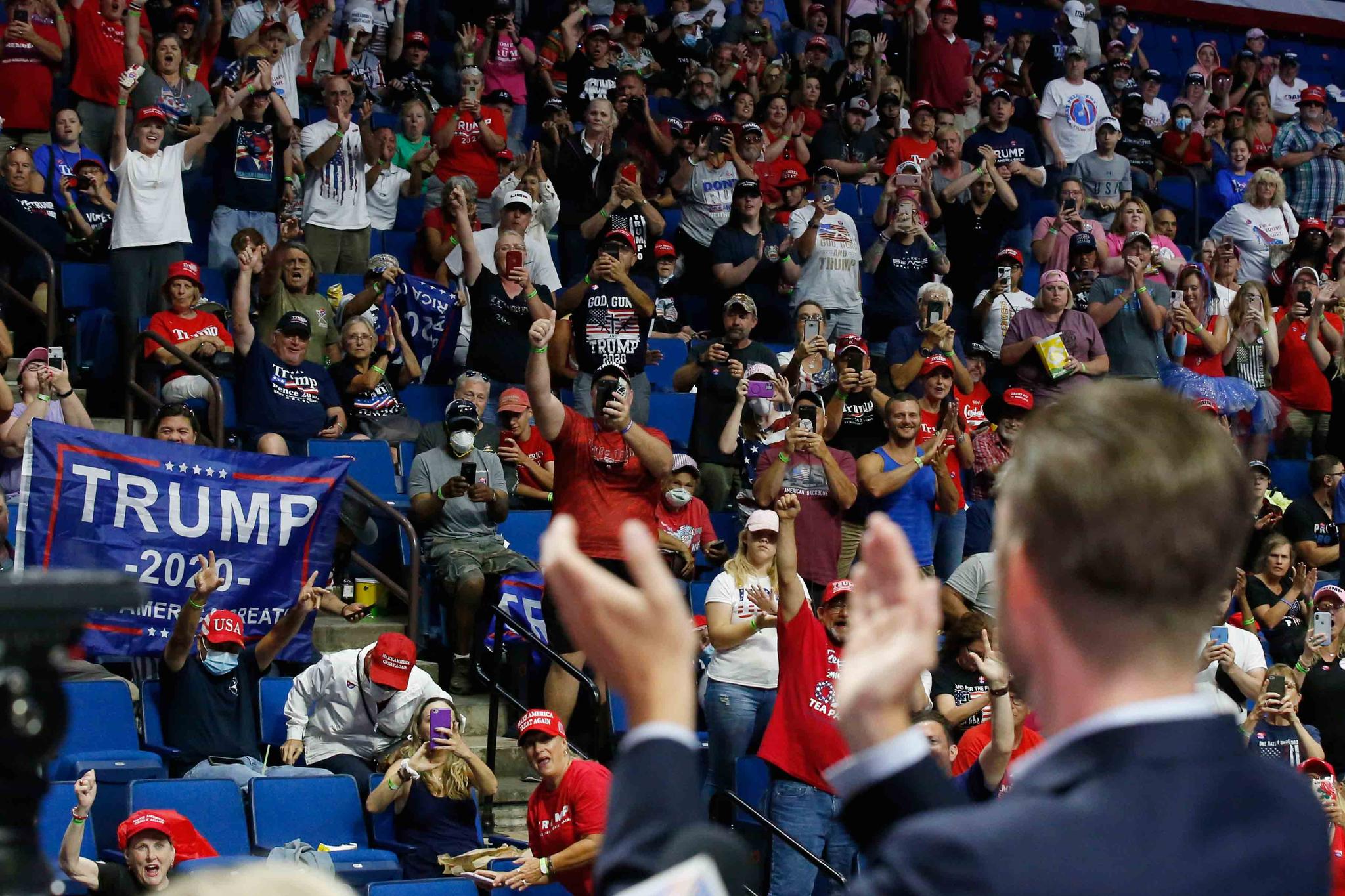 President Donald Trump supporters cheer Eric Trump, the son of President Donald Trump, before a Trump campaign rally in Tulsa, Oklahoma
