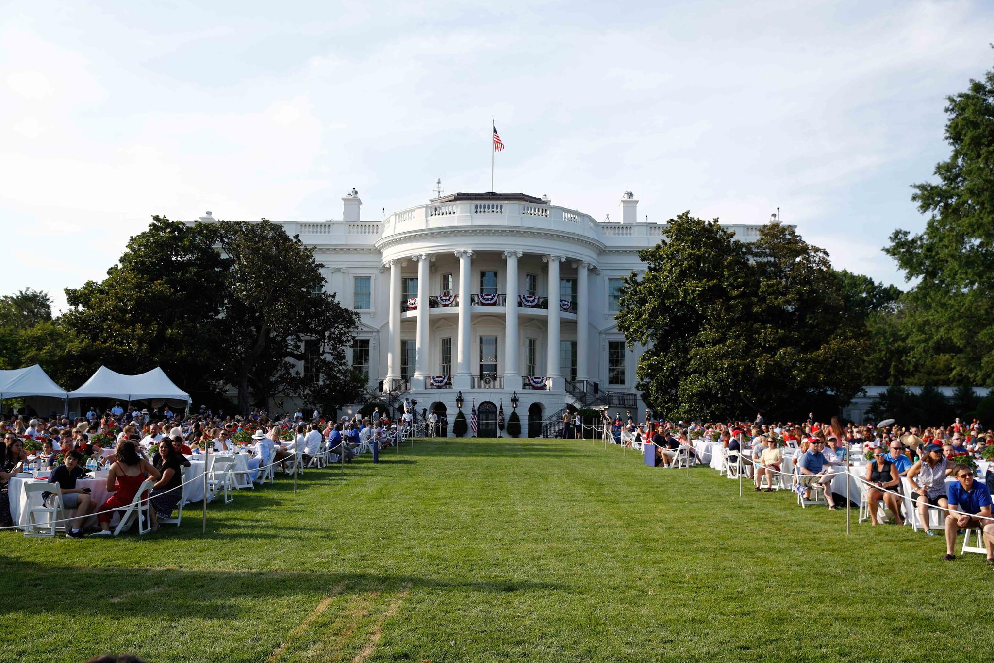 Guests wait for President Donald Trump and first lady Melania Trump during a "Salute to America" event on the South Lawn of the White House, Saturday, July 4, 2020, in Washington.