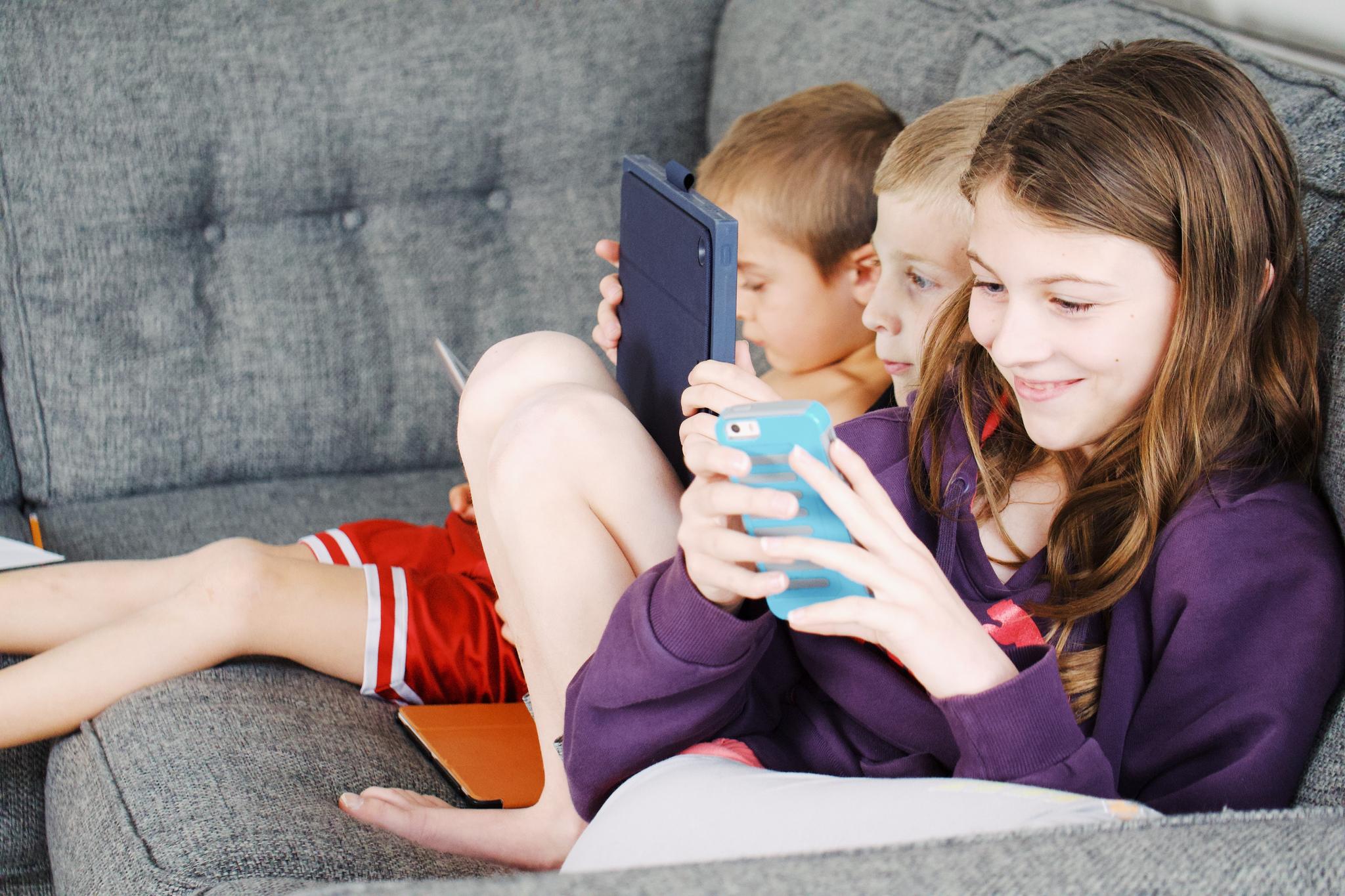 Kids sitting on couch 