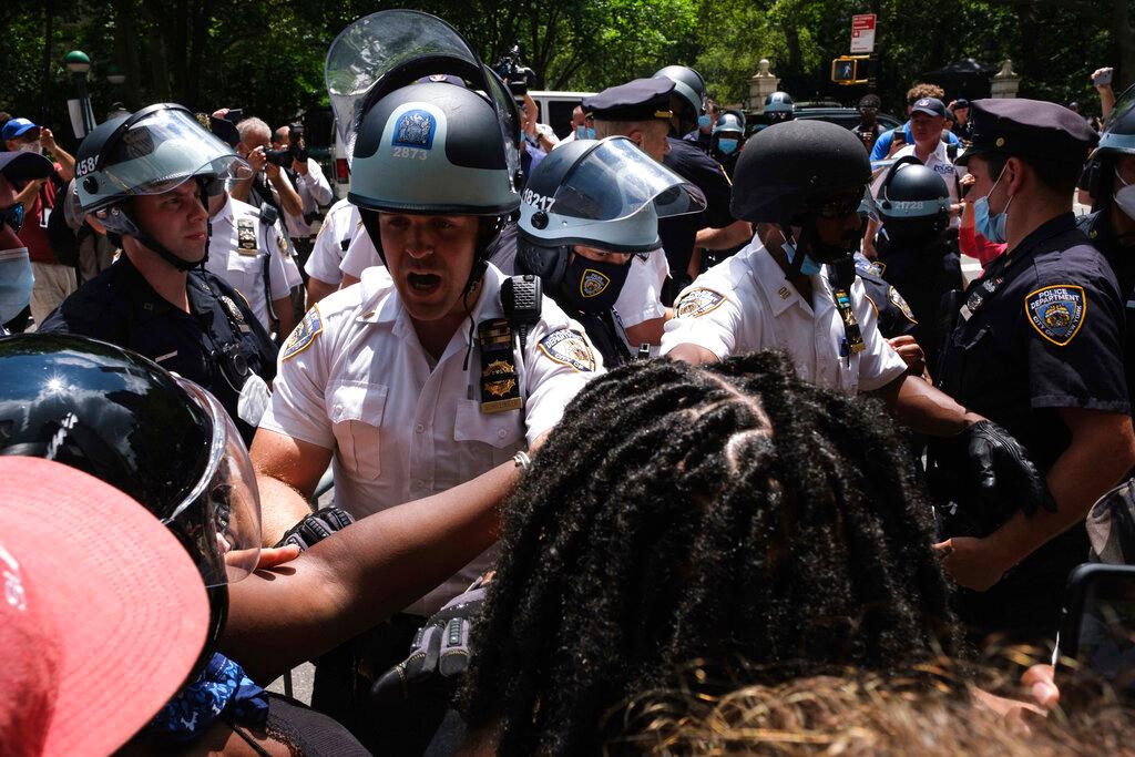 Black Lives Matter protesters and NYPD officers have a confrontation near City Hall Park