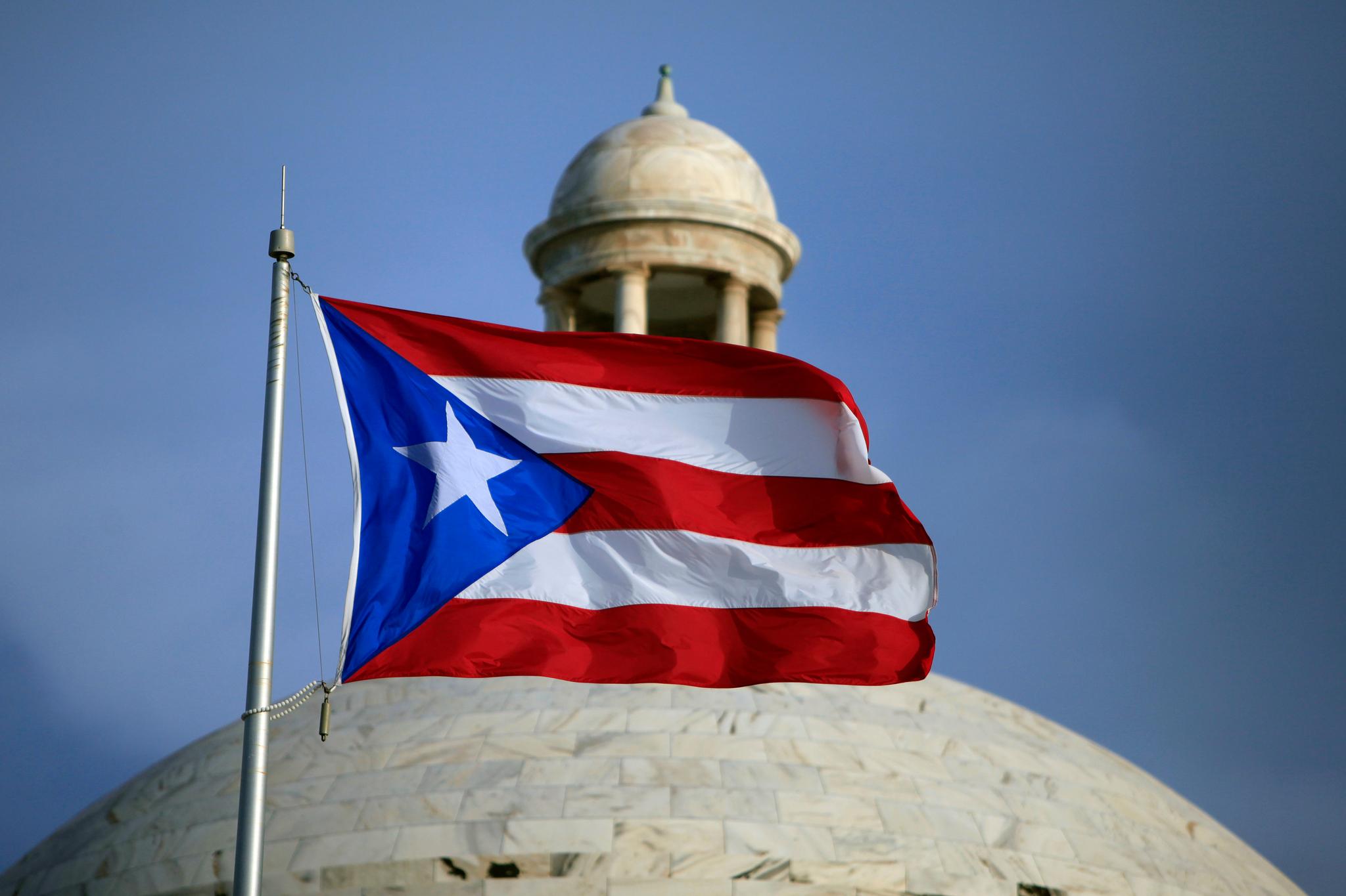  Puerto Rican flag flies in front of Puerto Rico's Capitol, San Juan, Puerto Rico