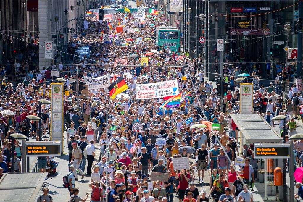 Thousands march along the 'Friedrichstrasse' during the demonstration against corona measures in Berlin, Germany, Saturday, Aug. 1, 2020. The initiative "Querdenken 711" has called for this. The motto of the demonstration is "The end of the pandemic - Freedom Day".