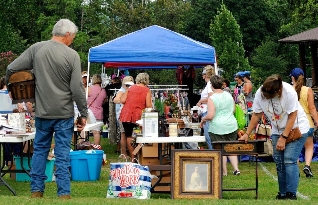 A crowd looks through items at the World's Longest Yard Sale