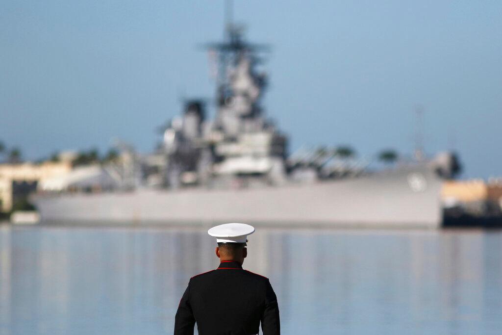 Marine in front of ship