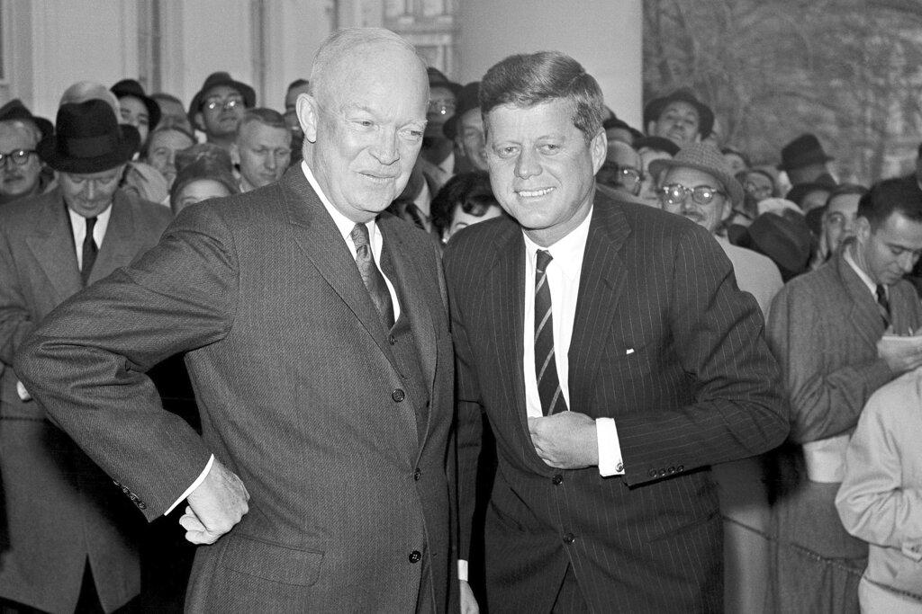 (Dec. 1960) President Dwight Eisenhower poses with President-elect John F. Kennedy at the White House