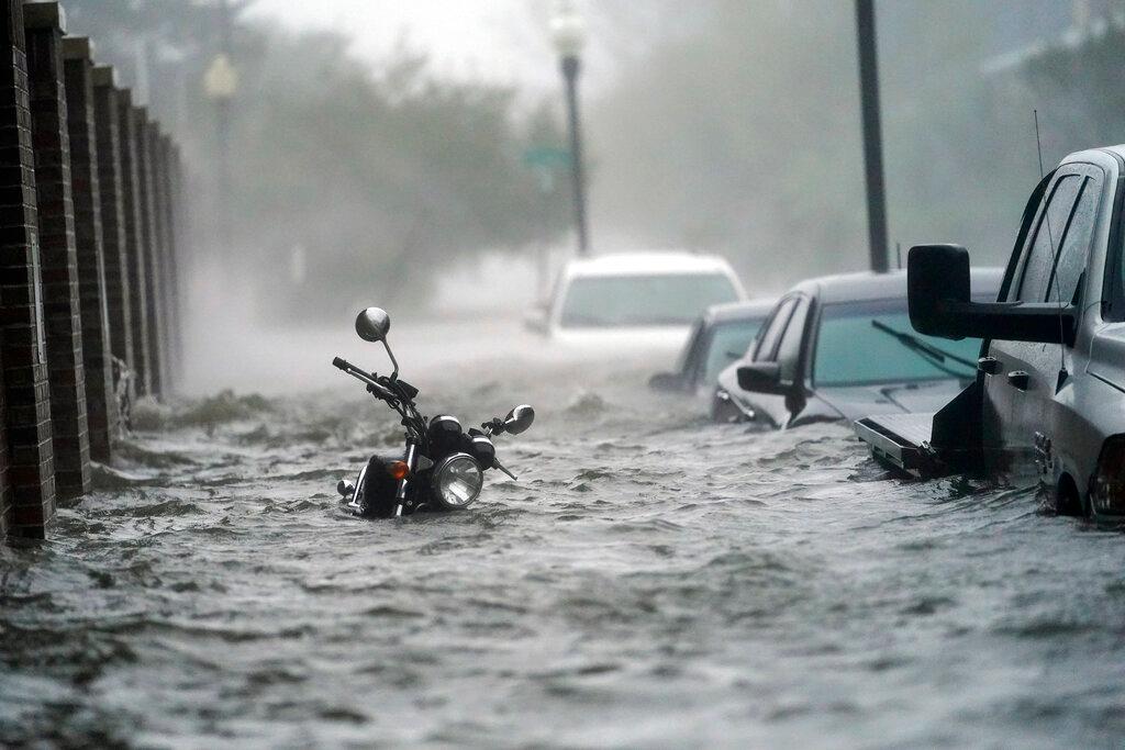 Flood waters move on the street in Pensacola, Fla.