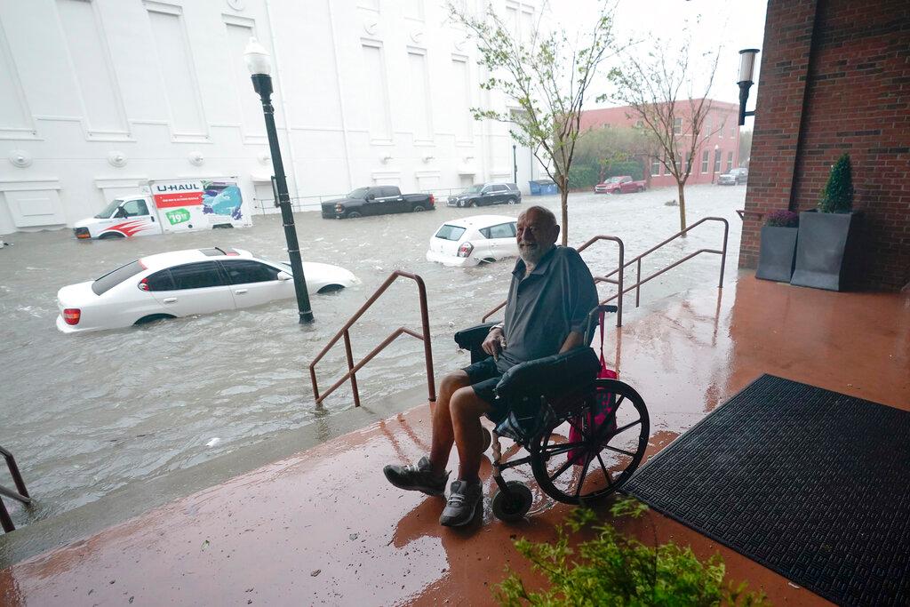 Man watches floodwaters in Pensacola 