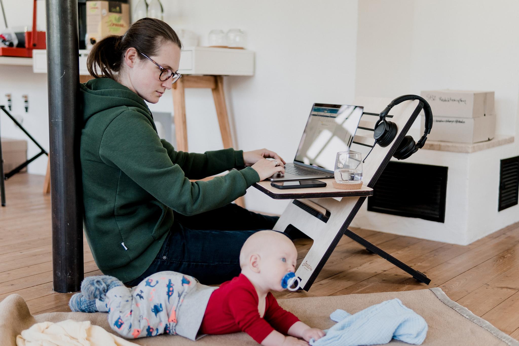 Mom and infant working from home 