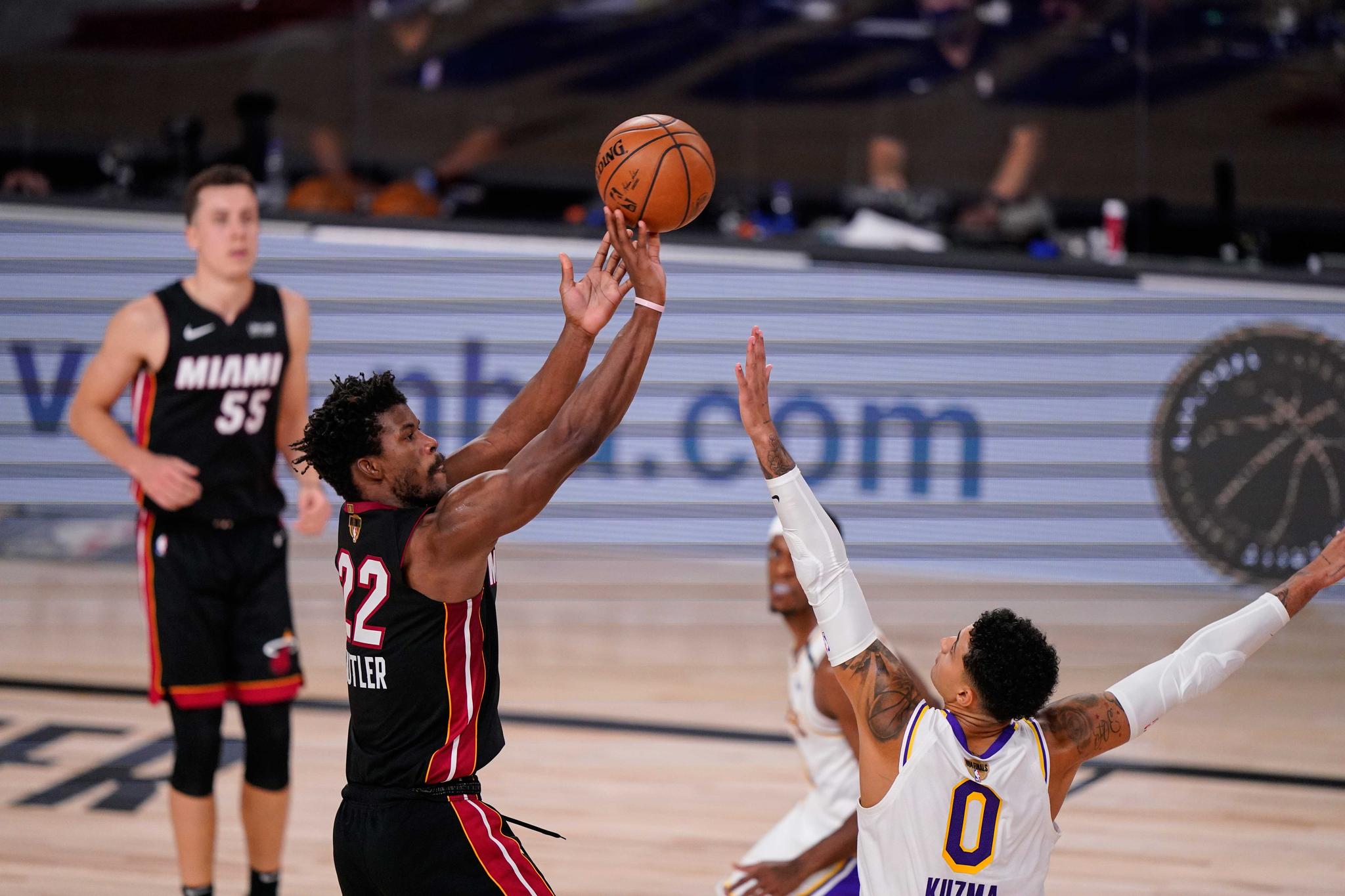 Miami Heat's Jimmy Butler shoots against Los Angeles Lakers' Kyle Kuzma