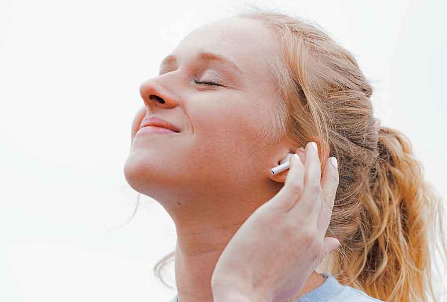 woman listening to music happy