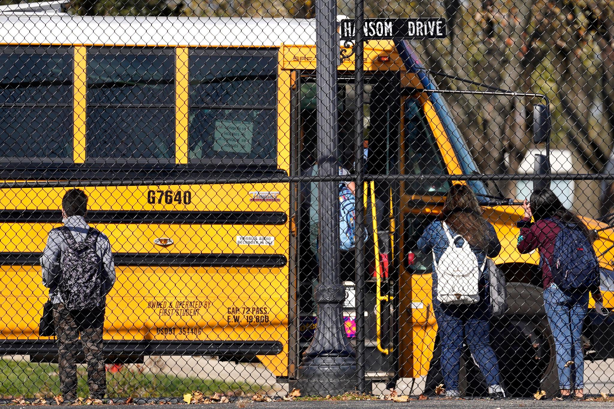 kids getting picked up by school bus