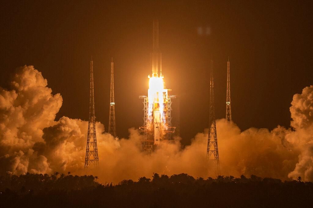 A Long March-5 rocket carrying the Chang'e 5 lunar mission lifts off at the Wenchang Space Launch Center in Wenchang in southern China's Hainan Province
