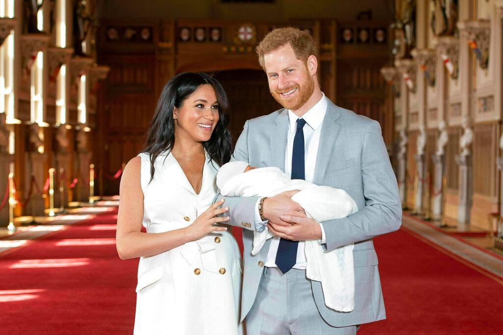 (2019) Britain's Prince Harry and Meghan, Duchess of Sussex, pose during a photocall with their newborn son Archie