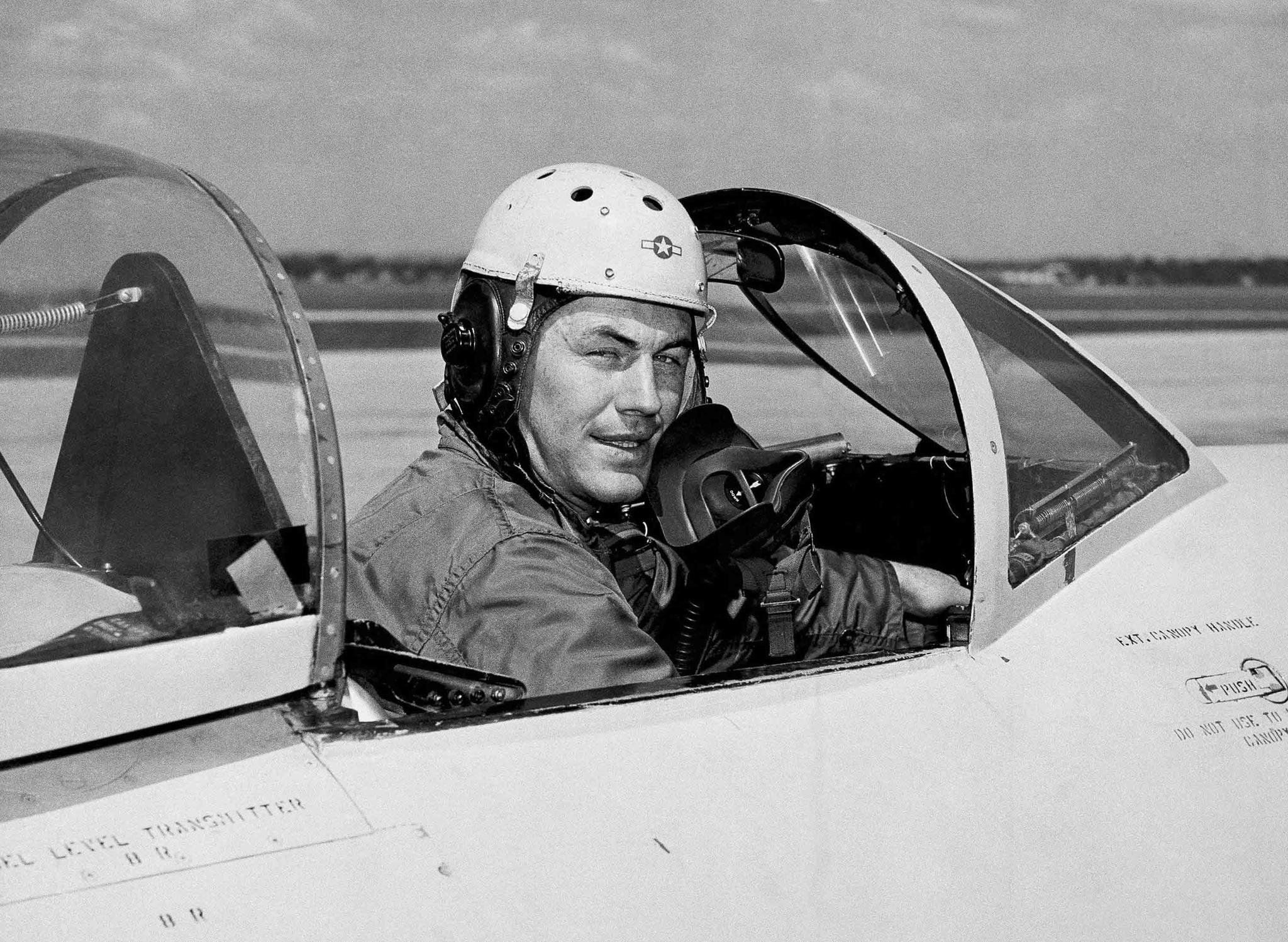 In this 1948 file photo, test pilot Charles E. Yeager, 25, poses for a picture in a jet's cockpit.