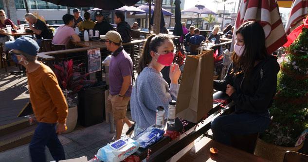 Patrons pick up their food to go orders