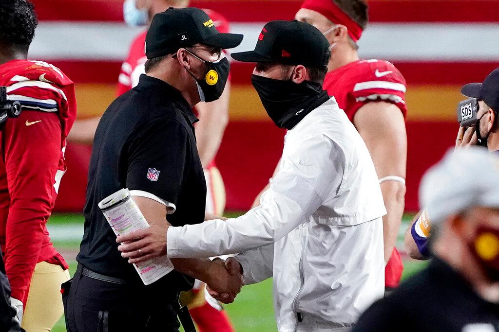 Coaches Ron Rivera and Kyle Shanahan after NFL Game 