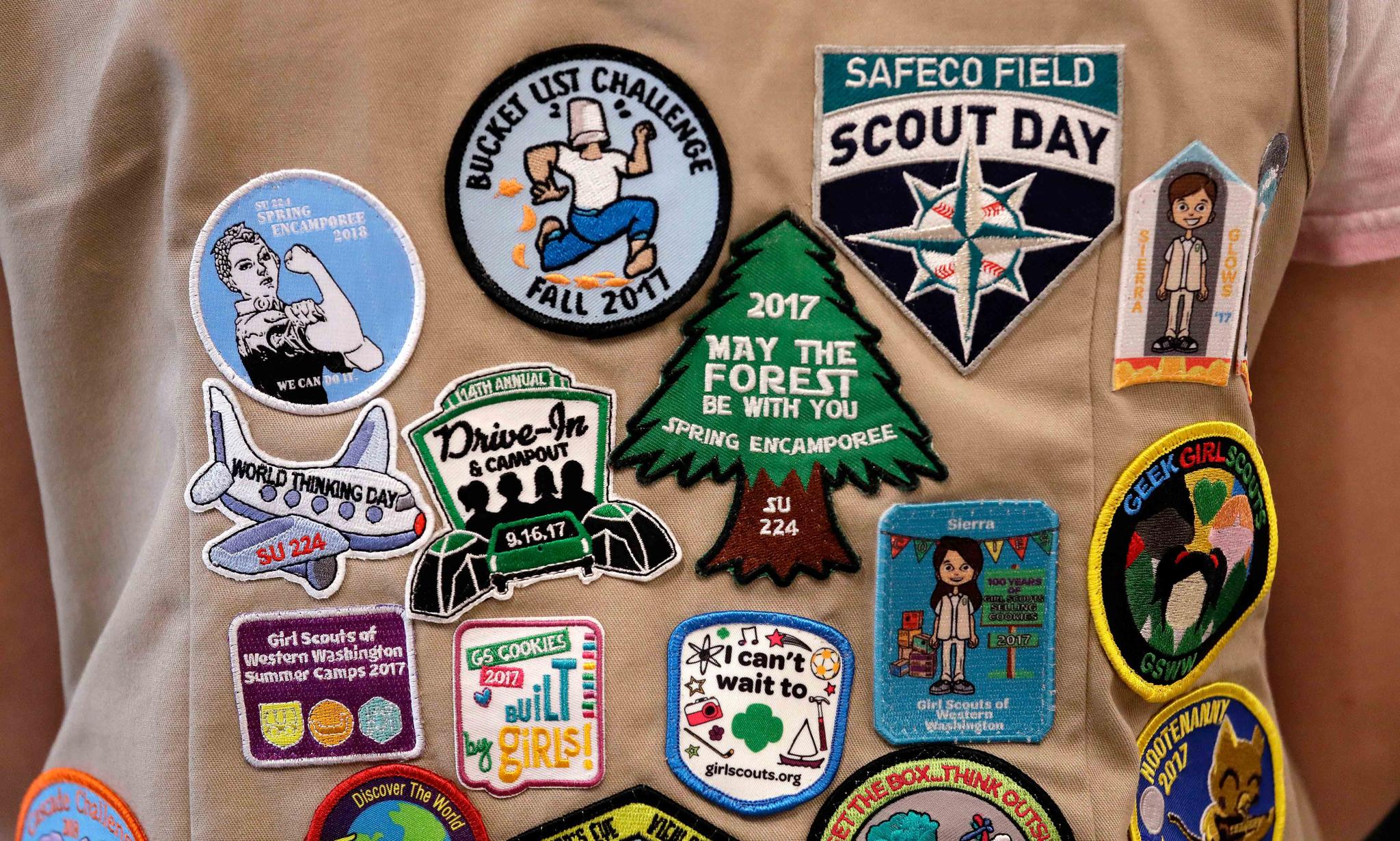 patches cover the back of a Girl Scout's vest at a demonstration of some of their activities in Seattle.