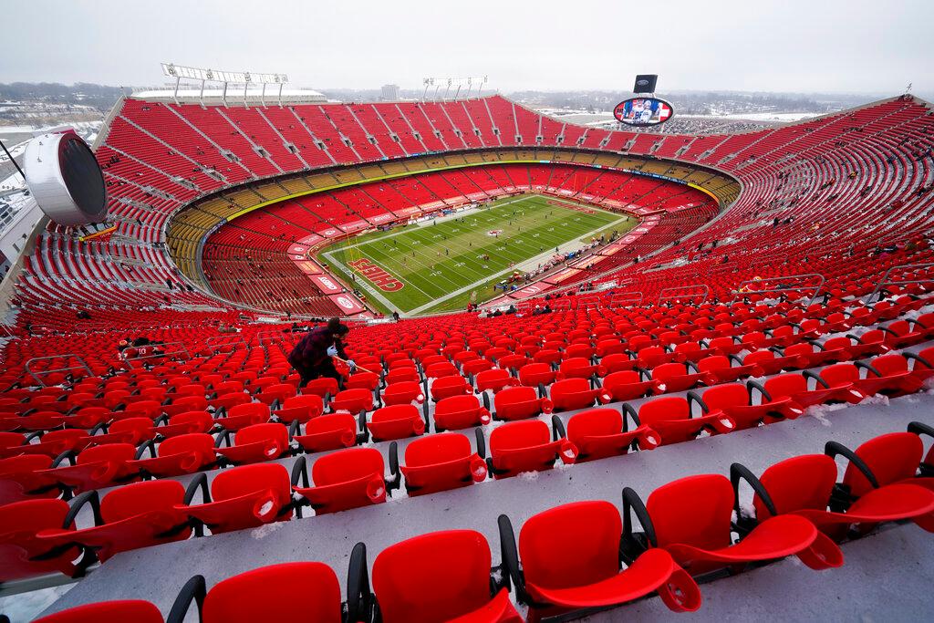 Worker cleans seats in Arrowhead Stadium before an NFL football game between the Kansas City Chiefs and the Los Angeles Chargers