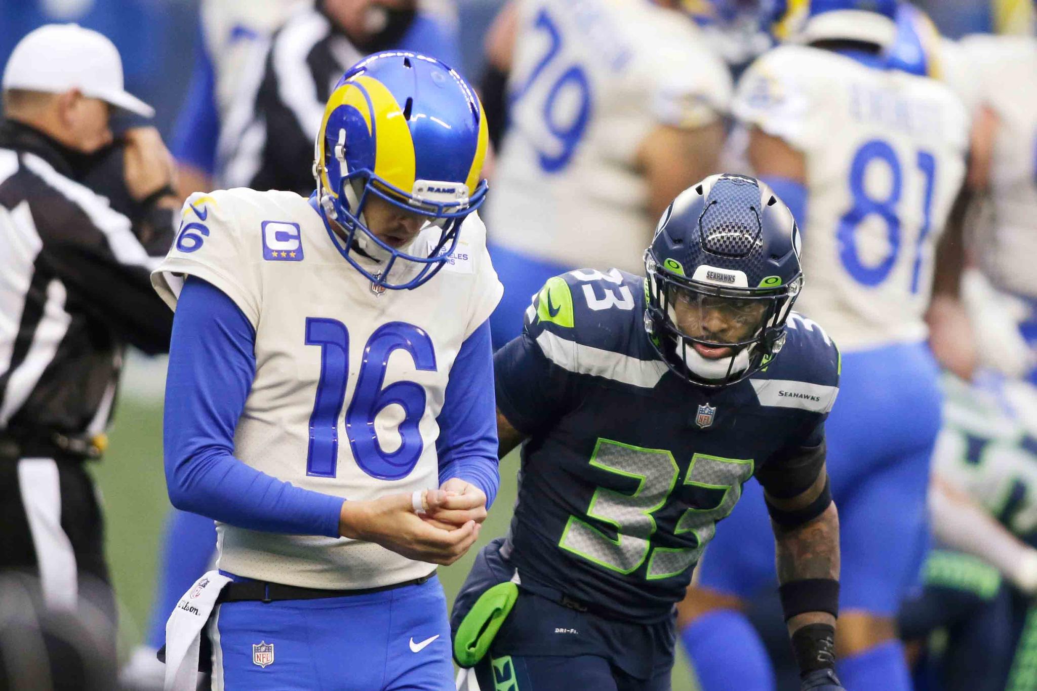 Seattle Seahawks strong safety Jamal Adams (33) looks at Los Angeles Rams quarterback Jared Goff during the second half of an NFL wild-card playoff football game, Saturday, Jan. 9, 2021, in Seattle. 