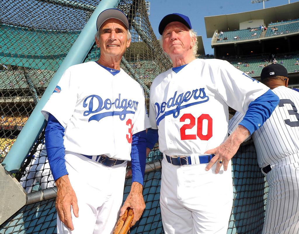 2013, photo shows Hall of Fame and former Los Angeles Dodgers pitcher Don Sutton, right, and Brooklyn Dodger pitcher Sandy Koufax, left, during the Old-Timers game