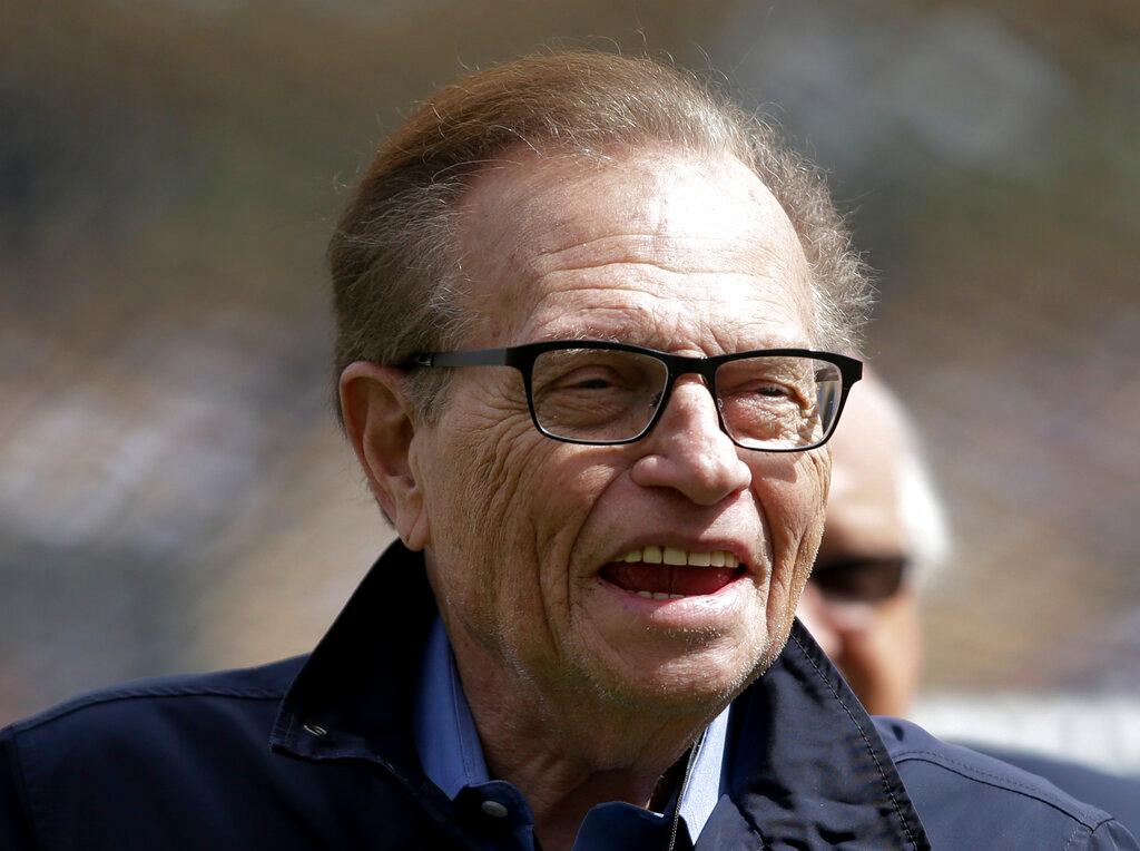 This April 1, 2013 file photo shows talk show host Larry King attends a season-opening baseball game between the Los Angeles Dodgers and the San Francisco Giants in Los Angeles. King, who interviewed presidents, movie stars and ordinary Joes during a half-century in broadcasting, has died at age 87. Ora Media, the studio and network he co-founded, tweeted that King died Saturday, Jan. 23, 2021 morning at Cedars-Sinai Medical Center in Los Angeles.