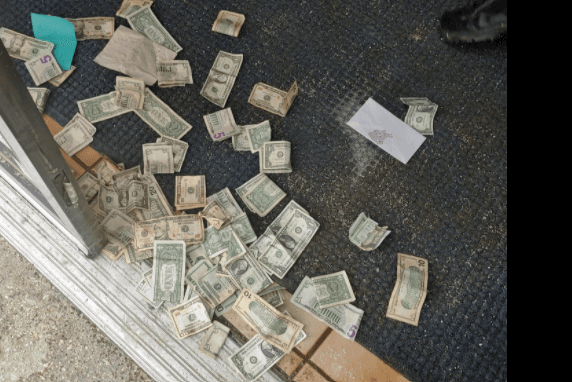 Cash left under store door