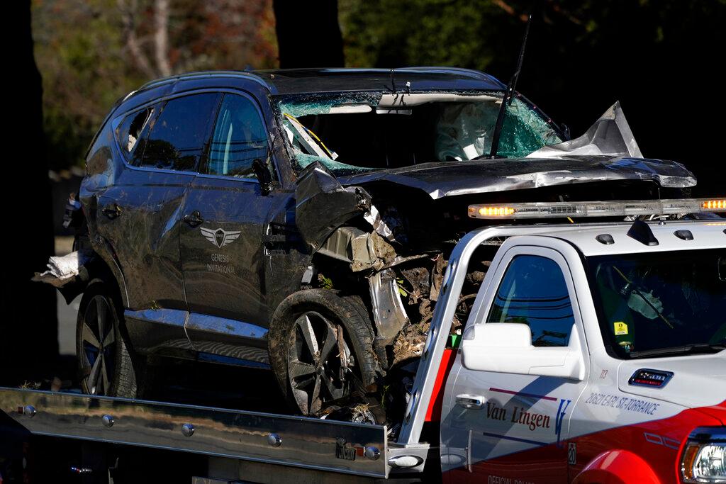 Vehicle is towed away from the site of a crash involving golfer Tiger Woods